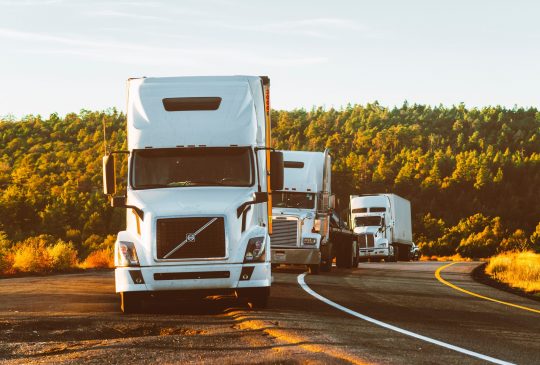 white-volvo-semi-truck-on-side-of-road-2199293